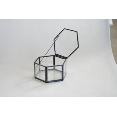 Black hexagon box with string